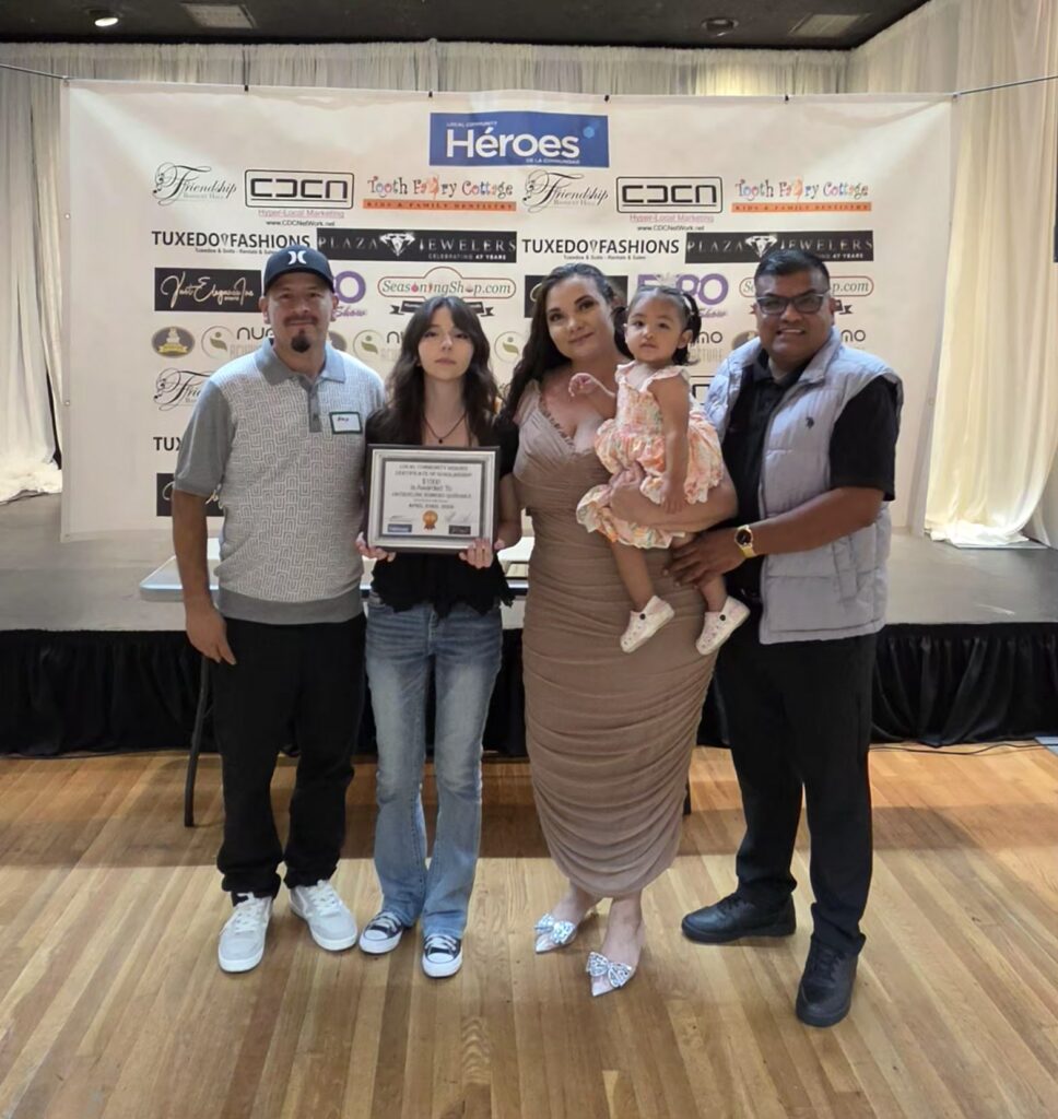 Local Community Heroes $1,000 scholarship recipient with family, April 2025